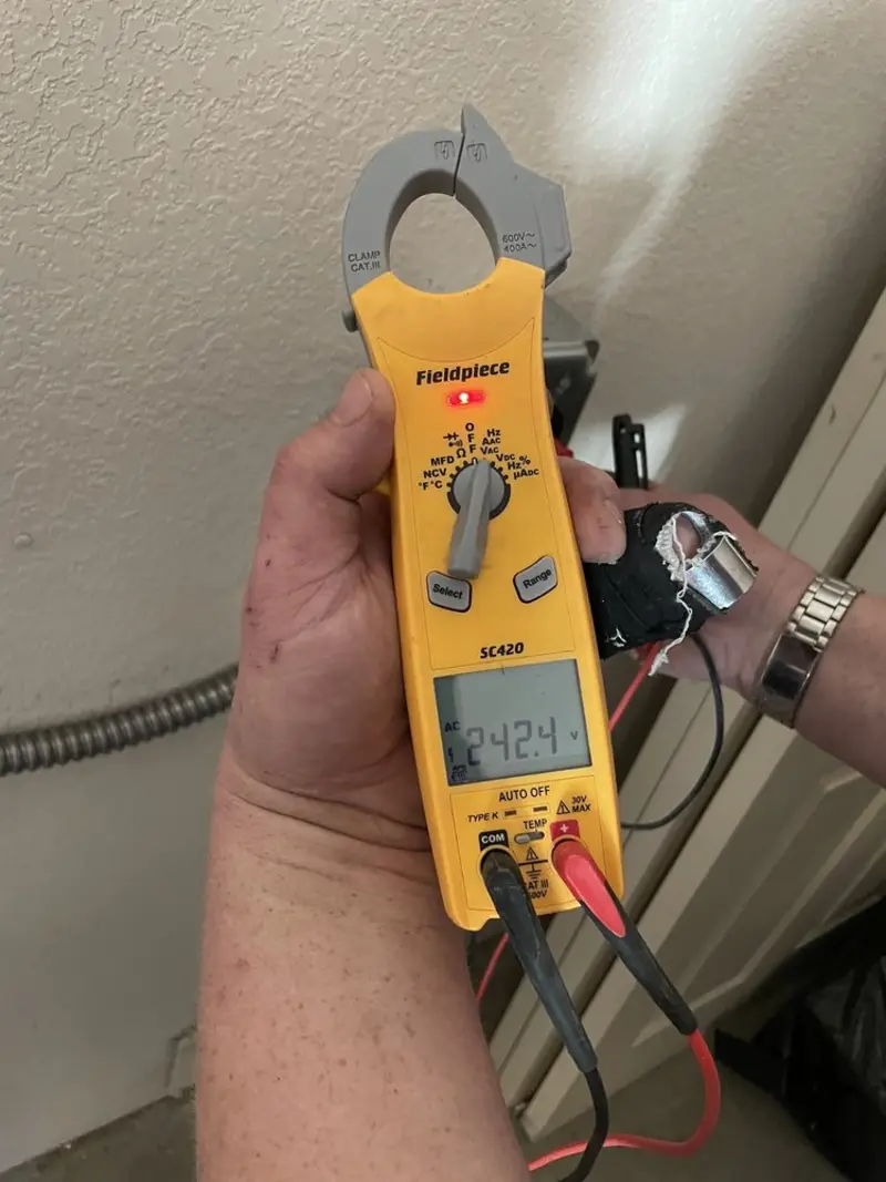 Voltage testing with clamp meter during Generator Installation in Greenwood Village